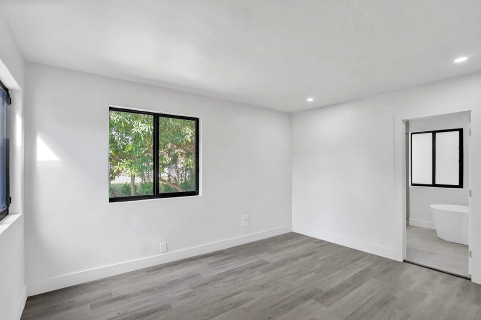 Shore Crest Miami home renovation third bedroom with modern design and spacious layout