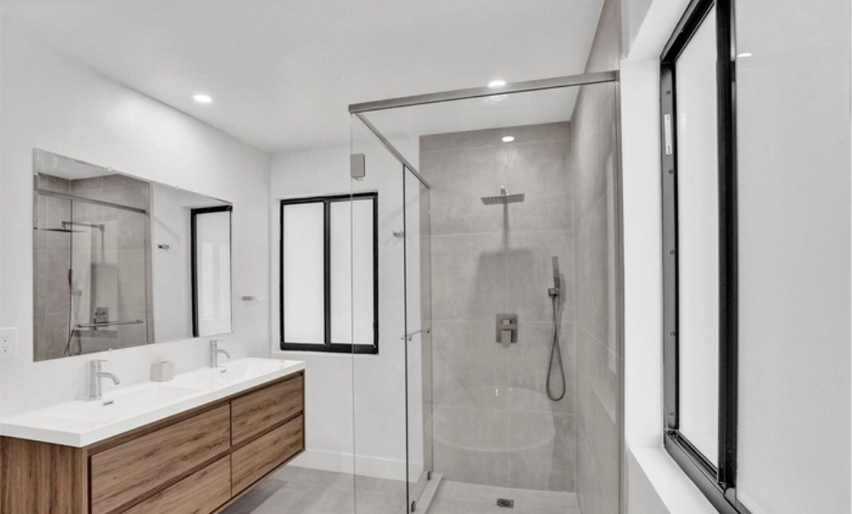 Shore Crest Miami home renovation bathroom with modern soaking tub and walk-in shower