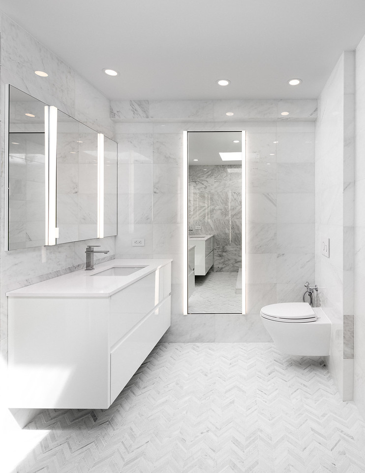 Master bathroom renovation in Upper West Side duplex apartment with Italian Carrara marble tiles