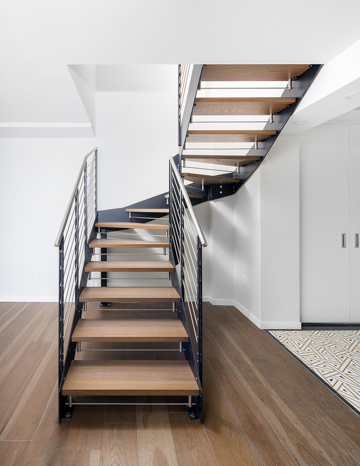 Floating oak wood steps and metal structure staircase in Upper West Side duplex renovation