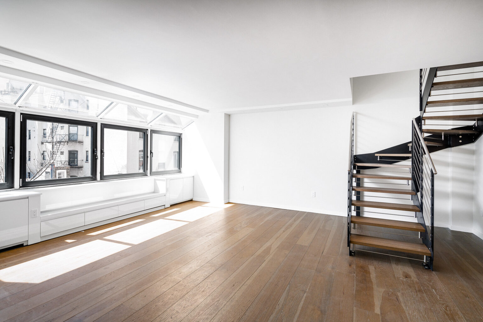 Upper West Side duplex apartment renovation showcasing modern yet industrial design aesthetic