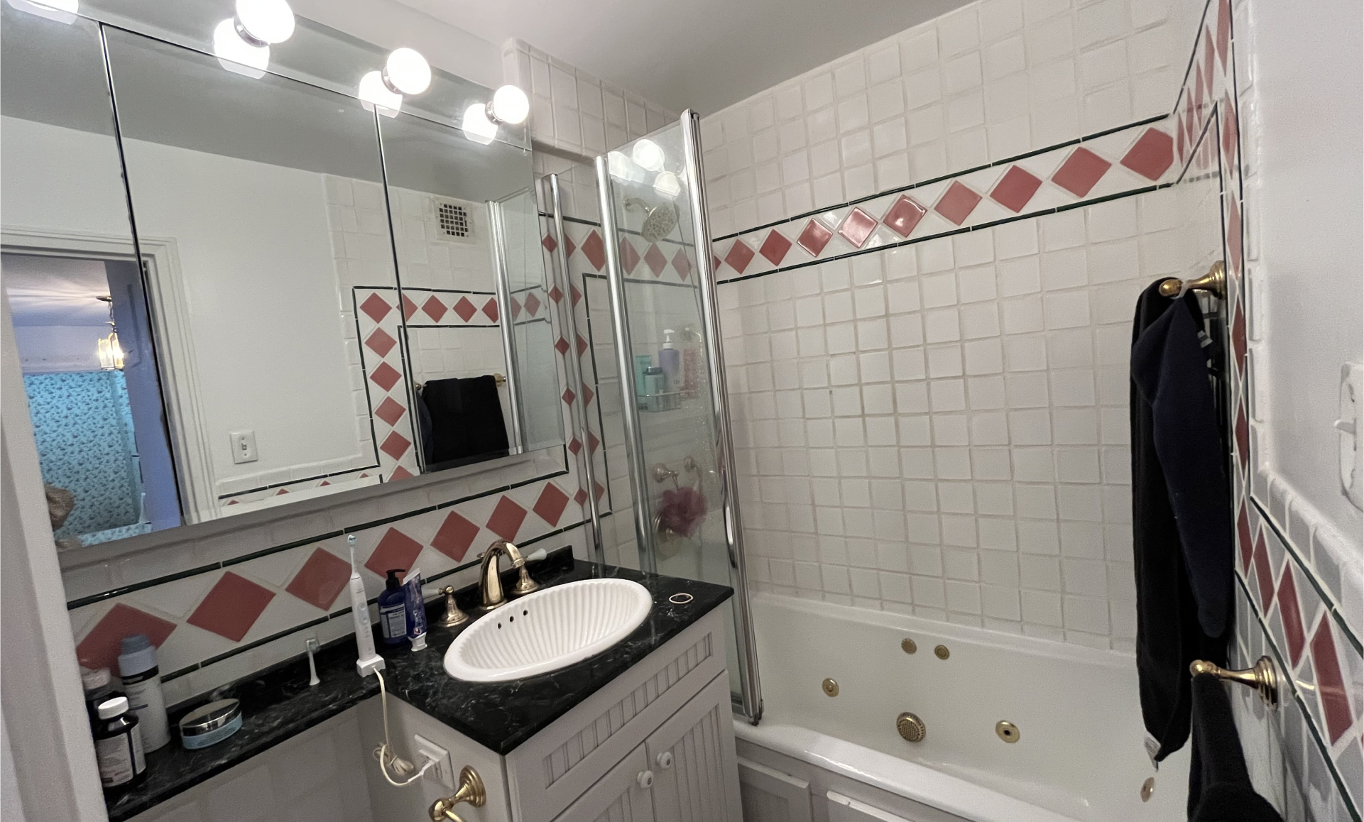 Greenwich Village apartment before renovation showing outdated cabinets