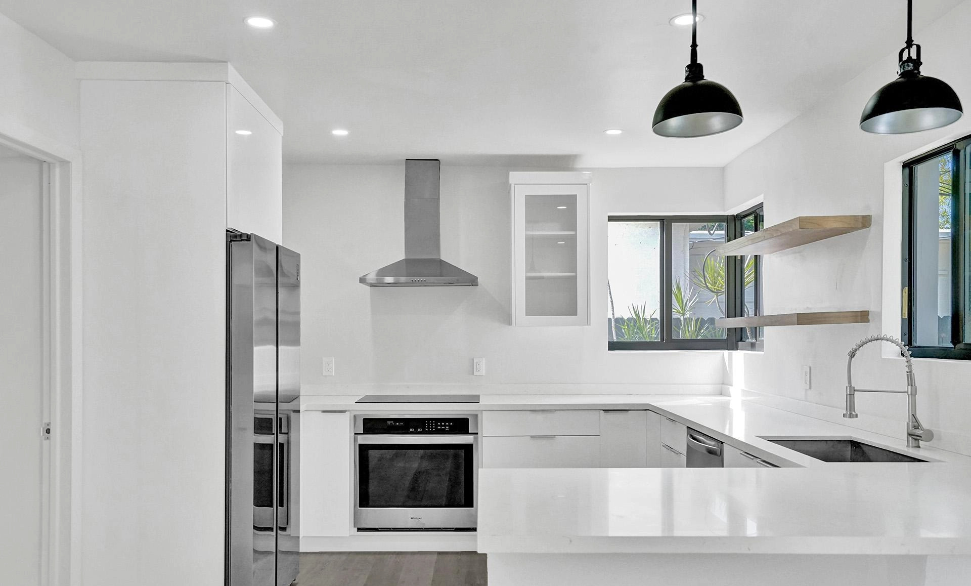 Shore Crest Miami home renovation after kitchen with modern finishes and French doors