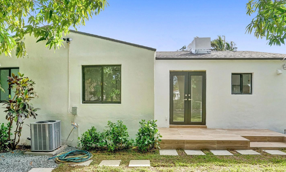 Shore Crest Miami home renovation after exterior view with modern design and updated landscaping