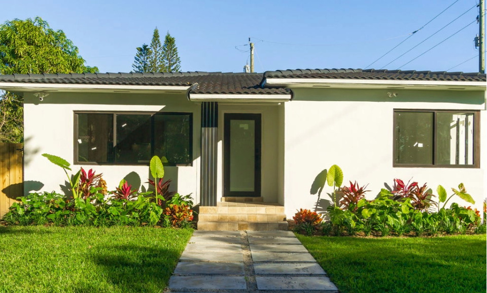 Miami Shores home renovation after exterior view with modern design and updated landscaping