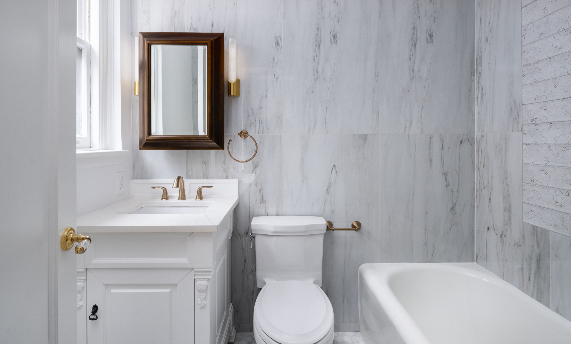 Midtown East apartment renovation living room with floral wallcovering and indigo accents