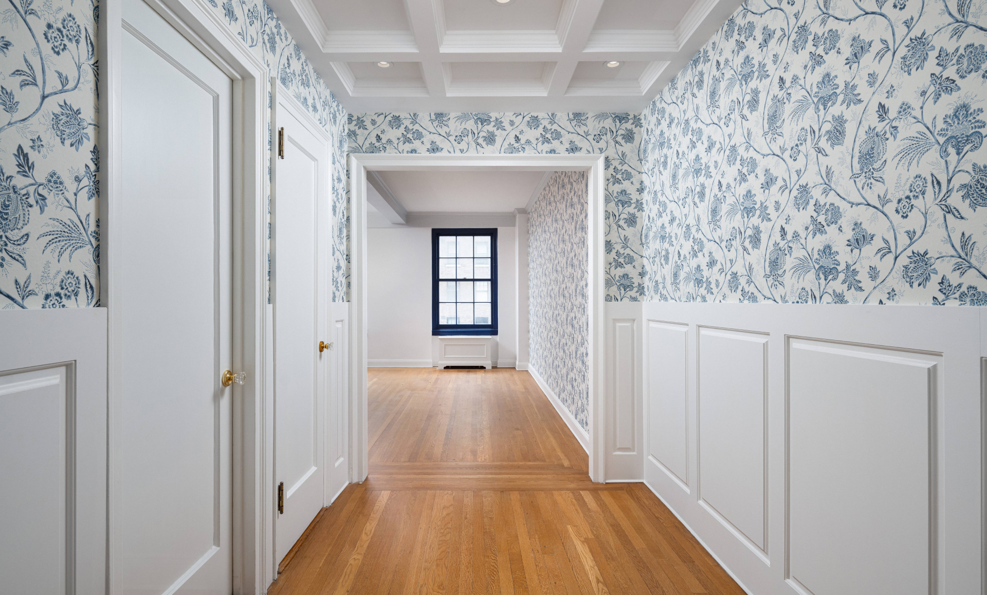 Midtown East apartment renovation primary bathroom with marble tiles and gold fixtures