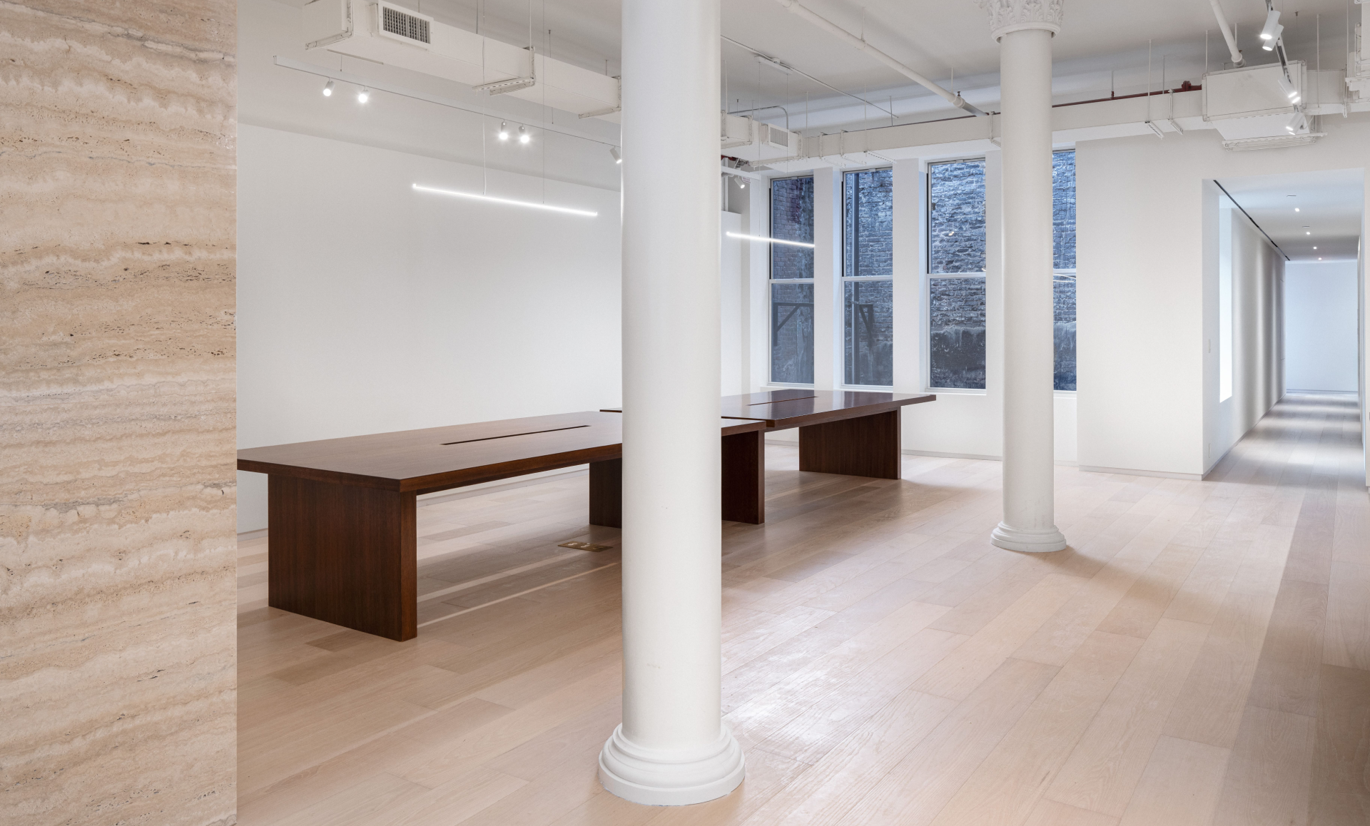 SoHo office renovation after photo showing elegant bathroom with earth-colored tiles