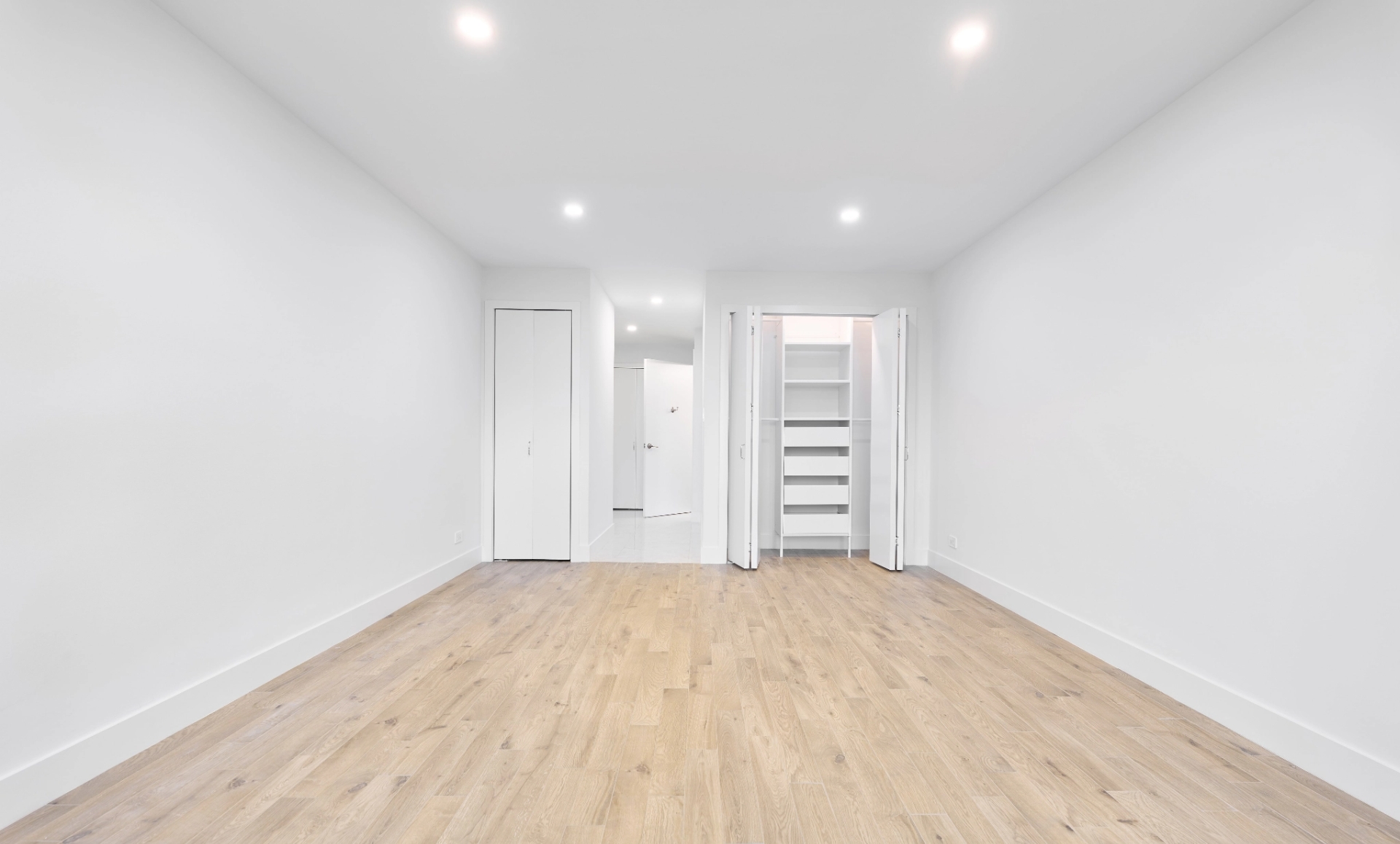 UES apartment renovation accessible living room with custom desk overlooking East River