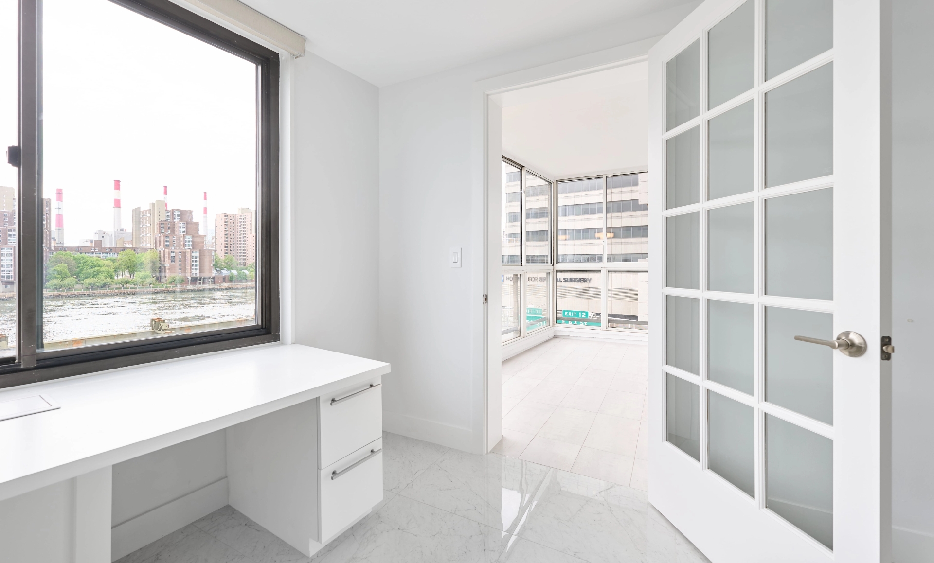 UES apartment renovation barrier-free flooring with white marble and wood-look tiles