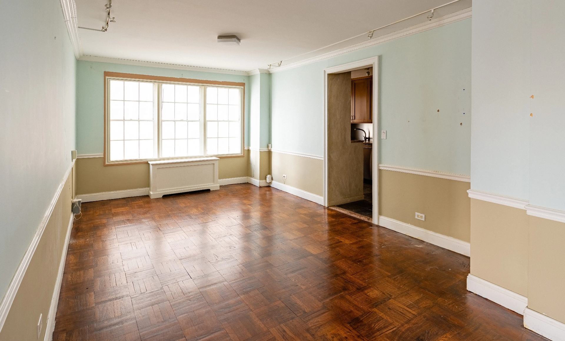 UES apartment renovation before photo showing outdated kitchen needing ADA compliance