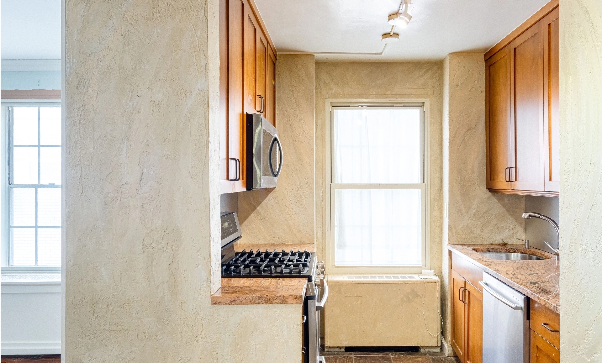 UES apartment renovation before photo showing outdated bathroom