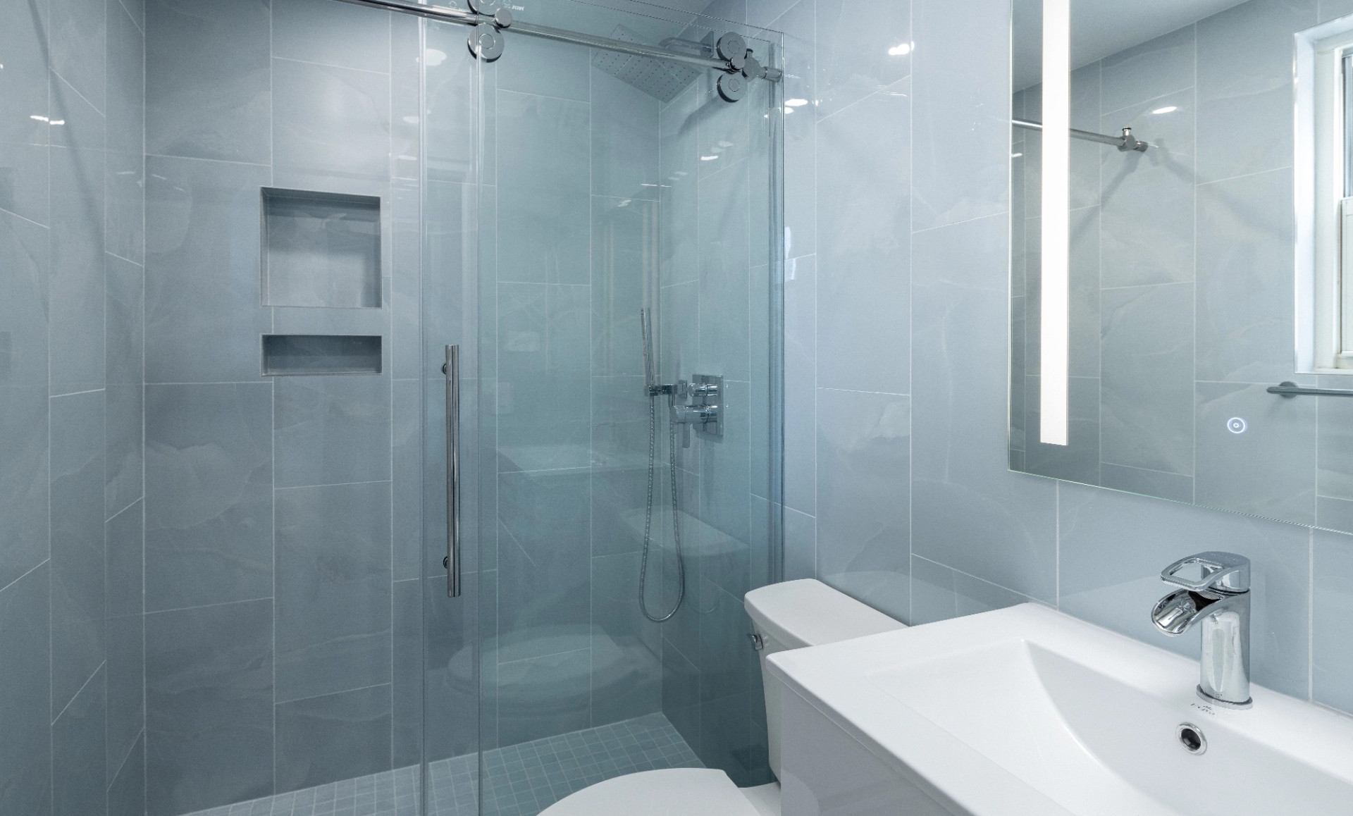 UES apartment after renovation with sophisticated grey mosaic tile backsplash