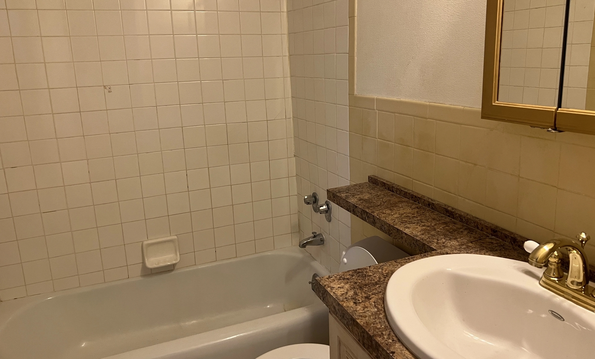 UES apartment before renovation showing outdated kitchen design