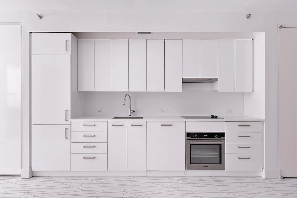 Upper Manhattan condo kitchen with modern design and quality materials