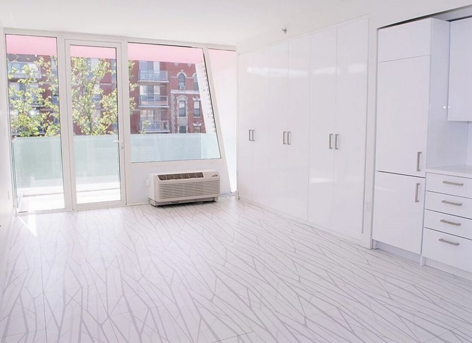 Upper Manhattan condo living space with contemporary storage solutions